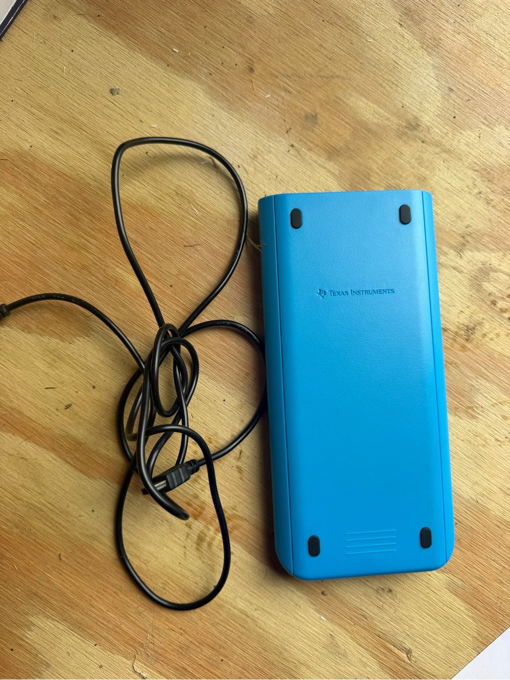 Texas Instruments Bright Blue Graphing Calculator with Black Cable